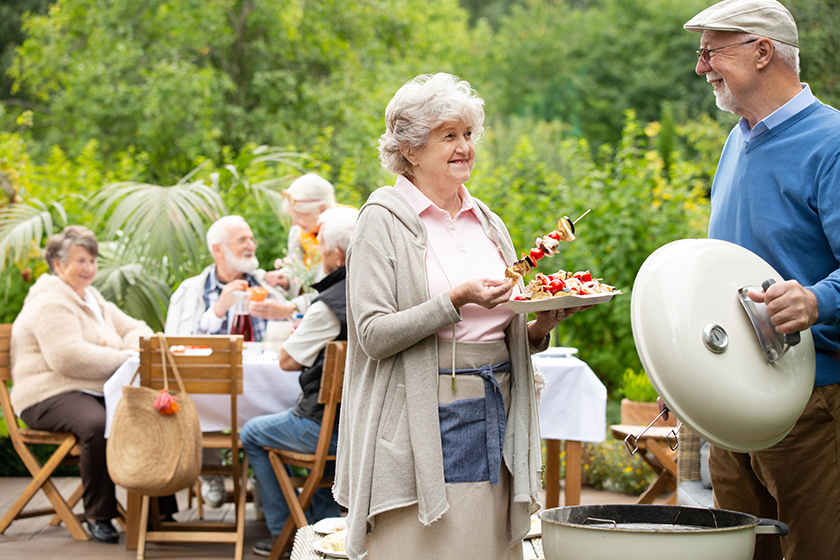 Woman serving skewers