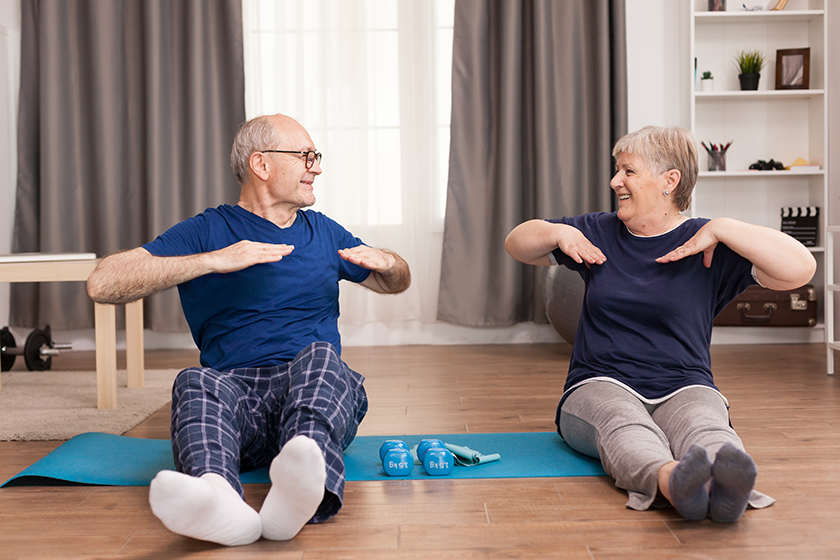 aged-people-stretching-on-yoga-mat