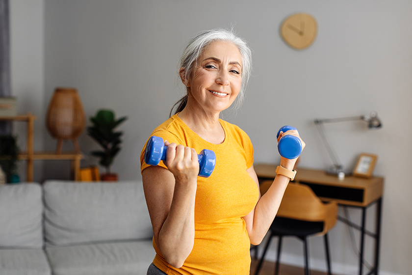 happy-senior-woman-doing-dumbbell-workout